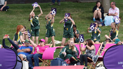 Girls in the Crowd Celebrate a Six