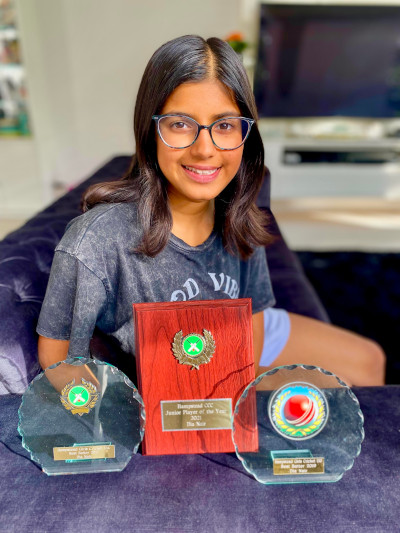 Dia with her trophies