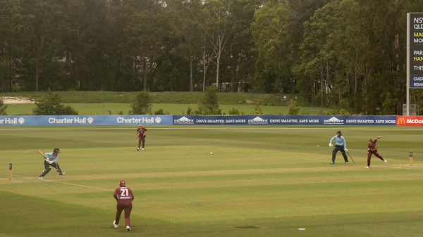 Queensland bowler Nicola Hancock sending a ball towards Katie Mack